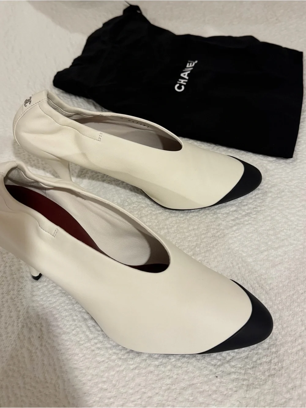 CHANEL Two-Tone White Leather Pumps with Black Cap Toe